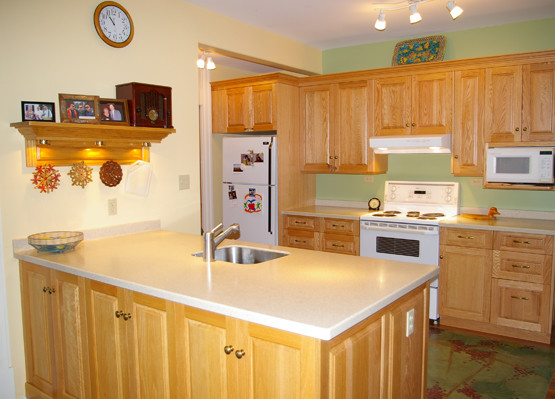 a well lit oak kitchen